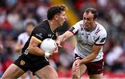22 June 2025; Pierce Laverty of Down is tackled by John Maher of Galway during the GAA Football All-Ireland Senior Championship preliminary quarter-final match between Down and Galway at Páirc Esler in Newry, Down. Photo by Ben McShane/Sportsfile