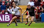 22 June 2025; Cian Hernon of Galway and Adam Crimmins of Down during the GAA Football All-Ireland Senior Championship preliminary quarter-final match between Down and Galway at Páirc Esler in Newry, Down. Photo by Ben McShane/Sportsfile