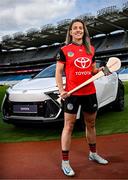 26 June 2025; Pictured pitch side in Croke Park at today’s launch of Toyota Ireland as the new Official Car Partner to The Camogie Association is Dublin Camogie captain and Toyota ambassador Aisling Maher with the Toyota C-HR Hybrid. Under this new three-year agreement, Toyota becomes the Official Car Partner to these sporting organisations and reflects Toyota’s continued commitment to supporting Irish sport and communities across the country. Photo by Seb Daly/Sportsfile