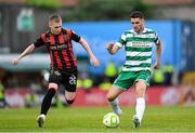 23 June 2025; Dylan Watts of Shamrock Rovers in action against Ross Tierney of Bohemians during the SSE Airtricity Men's Premier Division match between Bohemians and Shamrock Rovers at Dalymount Park in Dublin. Photo by Shauna Clinton/Sportsfile