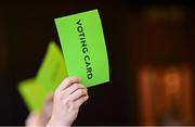 25 July 2025; Attendees hold up voting cards the Olympic Federation of Ireland AGM at The Alex Hotel in Dublin. Photo by Seb Daly/Sportsfile