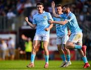 20 June 2025; Simon Power of St Patrick's Athletic celebrates with team-mates Aidan Keena and Axel Sjoberg, centre, after scoring their side's first goal during the SSE Airtricity Men's Premier Division match between Galway United and St Patrick's Athletic at Eamonn Deacy Park in Galway. Photo by Piaras Ó Mídheach/Sportsfile