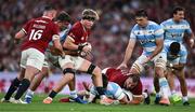 20 June 2025; Henry Pollock of British & Irish Lions is tackled by Joaquín Moro of Argentina during the Lions 1888 Cup match between the British & Irish Lions and Argentina at the Aviva Stadium in Dublin. Photo by Brendan Moran/Sportsfile