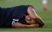 26 June 2025; Michelle Cooper of United States reacts after sustaining an injury following a tackle from Chloe Mustaki of Republic of Ireland, not pictured, during the women's international friendly match between the USA and Republic of Ireland at Dick’s Sporting Goods Park in Commerce City, Colorado, USA. Photo by Stephen McCarthy/Sportsfile