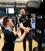 27 June 2025; Sarto Kiernan competes on the wall balls watched by pro heavyweight boxer Thomas Carty during the Fitness Inclusion Games by IWA at the Sport Ireland Indoor Arena on the National Sports Campus in Dublin. Photo by David Fitzgerald/Sportsfile