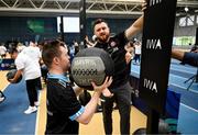 27 June 2025; Sarto Kiernan competes on the wall balls watched by pro heavyweight boxer Thomas Carty during the Fitness Inclusion Games by IWA at the Sport Ireland Indoor Arena on the National Sports Campus in Dublin. Photo by David Fitzgerald/Sportsfile