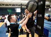27 June 2025; Sarto Kiernan competes on the wall balls watched by pro heavyweight boxer Thomas Carty during the Fitness Inclusion Games by IWA at the Sport Ireland Indoor Arena on the National Sports Campus in Dublin. Photo by David Fitzgerald/Sportsfile