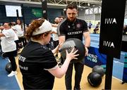 27 June 2025; Amy Barry competes on the wall balls watched by pro heavyweight boxer Thomas Carty during the Fitness Inclusion Games by IWA at the Sport Ireland Indoor Arena on the National Sports Campus in Dublin. Photo by David Fitzgerald/Sportsfile