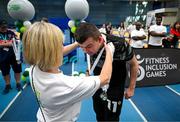 27 June 2025; Competitors receive their medals after the Fitness Inclusion Games by IWA at the Sport Ireland Indoor Arena on the National Sports Campus in Dublin. Photo by David Fitzgerald/Sportsfile