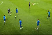 27 June 2025; Waterford players warm up before the SSE Airtricity Men's Premier Division match between Shamrock Rovers and Waterford at Tallaght Stadium in Dublin. Photo by Thomas Flinkow/Sportsfile