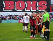 27 June 2025; Dawson Devoy of Bohemians shakes hands with match officials before the SSE Airtricity Men's Premier Division match between Bohemians and Sligo Rovers at Dalymount Park in Dublin. Photo by Seb Daly/Sportsfile