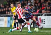 27 June 2025; Luke Heeney of Drogheda United is tackled by Ronan Boyce of Derry City during the SSE Airtricity Men's Premier Division match between Derry City and Drogheda United at The Ryan McBride Brandywell Stadium in Derry. Photo by Shauna Clinton/Sportsfile