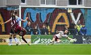 27 June 2025; Shelbourne goalkeeper Conor Kearns makes a save from Malcolm Shaw of Galway United, left, during the SSE Airtricity Men's Premier Division match between Galway United and Shelbourne at Eamonn Deacy Park in Galway. Photo by Piaras Ó Mídheach/Sportsfile