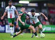 27 June 2025; Sean Maguire of Cork City is tackled by Joe Redmond of St Patrick's Athletic during the SSE Airtricity Men's Premier Division match between Cork City and St Patrick's Athletic at Turner's Cross in Cork. Photo by Brendan Moran/Sportsfile