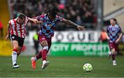27 June 2025; Aaron Harper-Bailey of Drogheda United in action against Gavin Whyte of Derry City during the SSE Airtricity Men's Premier Division match between Derry City and Drogheda United at The Ryan McBride Brandywell Stadium in Derry. Photo by Shauna Clinton/Sportsfile