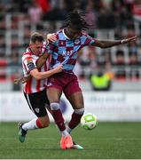 27 June 2025; Aaron Harper-Bailey of Drogheda United in action against Gavin Whyte of Derry City during the SSE Airtricity Men's Premier Division match between Derry City and Drogheda United at The Ryan McBride Brandywell Stadium in Derry. Photo by Shauna Clinton/Sportsfile