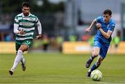 27 June 2025; Jesse Dempsey of Waterford in action against Danny Mandroiu of Shamrock Rovers during the SSE Airtricity Men's Premier Division match between Shamrock Rovers and Waterford at Tallaght Stadium in Dublin. Photo by Thomas Flinkow/Sportsfile