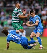 27 June 2025; Graham Burke of Shamrock Rovers in action against Waterford players Ryan Burke, 3, and Darragh Leahy during the SSE Airtricity Men's Premier Division match between Shamrock Rovers and Waterford at Tallaght Stadium in Dublin. Photo by Thomas Flinkow/Sportsfile
