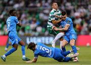 27 June 2025; Graham Burke of Shamrock Rovers is tackled by Waterford players Ryan Burke, 3, and Darragh Leahy during the SSE Airtricity Men's Premier Division match between Shamrock Rovers and Waterford at Tallaght Stadium in Dublin. Photo by Thomas Flinkow/Sportsfile
