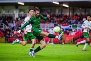 27 June 2025; Mason Melia of St Patrick's Athletic in action against Charlie Lyons of Cork City during the SSE Airtricity Men's Premier Division match between Cork City and St Patrick's Athletic at Turner's Cross in Cork. Photo by Brendan Moran/Sportsfile