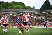 27 June 2025; Kevin Holt of Derry City in action against Douglas James-Taylor of Drogheda United during the SSE Airtricity Men's Premier Division match between Derry City and Drogheda United at The Ryan McBride Brandywell Stadium in Derry. Photo by Shauna Clinton/Sportsfile