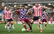 27 June 2025; Kevin Holt of Derry City in action against Douglas James-Taylor of Drogheda United during the SSE Airtricity Men's Premier Division match between Derry City and Drogheda United at The Ryan McBride Brandywell Stadium in Derry. Photo by Shauna Clinton/Sportsfile