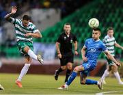 27 June 2025; Lee Grace of Shamrock Rovers attempts a shot on goal despite the efforts of Darragh Leahy of Waterford during the SSE Airtricity Men's Premier Division match between Shamrock Rovers and Waterford at Tallaght Stadium in Dublin. Photo by Thomas Flinkow/Sportsfile