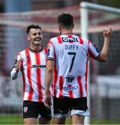 27 June 2025; Danny Mullen of Derry City, left, celebrates with team-mate Michael Duffy after scoring his side's third goal during the SSE Airtricity Men's Premier Division match between Derry City and Drogheda United at The Ryan McBride Brandywell Stadium in Derry. Photo by Shauna Clinton/Sportsfile