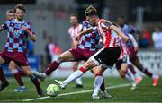 27 June 2025; Michael Duffy of Derry City kicks the ball to team-mate Danny Mullen on the lead up to their side's third goal during the SSE Airtricity Men's Premier Division match between Derry City and Drogheda United at The Ryan McBride Brandywell Stadium in Derry. Photo by Shauna Clinton/Sportsfile