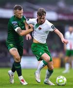 27 June 2025; Alex Nolan of Cork City is tackled by Jamie Lennon of St Patrick's Athletic during the SSE Airtricity Men's Premier Division match between Cork City and St Patrick's Athletic at Turner's Cross in Cork. Photo by Brendan Moran/Sportsfile