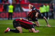 27 June 2025; Bohemians players Dawson Devoy, back, and Dayle Rooney react at the final whistle after the SSE Airtricity Men's Premier Division match between Bohemians and Sligo Rovers at Dalymount Park in Dublin. Photo by Seb Daly/Sportsfile