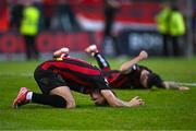 27 June 2025; Bohemians players Dayle Rooney, front, and Dawson Devoy react at the final whistle after the SSE Airtricity Men's Premier Division match between Bohemians and Sligo Rovers at Dalymount Park in Dublin. Photo by Seb Daly/Sportsfile