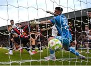 27 June 2025; Sligo Rovers goalkeeper Sam Sargeant concedes a goal in additional time at the end of the second half, scored by James Clarke of Bohemians, back, during the SSE Airtricity Men's Premier Division match between Bohemians and Sligo Rovers at Dalymount Park in Dublin. Photo by Seb Daly/Sportsfile