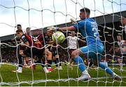27 June 2025; Sligo Rovers goalkeeper Sam Sargeant concedes a goal in additional time at the end of the second half, scored by James Clarke of Bohemians, back, during the SSE Airtricity Men's Premier Division match between Bohemians and Sligo Rovers at Dalymount Park in Dublin. Photo by Seb Daly/Sportsfile