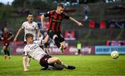 27 June 2025; Ross Tierney of Bohemians is tackled by Conor Reynolds of Sligo Rovers during the SSE Airtricity Men's Premier Division match between Bohemians and Sligo Rovers at Dalymount Park in Dublin. Photo by Seb Daly/Sportsfile