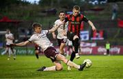 27 June 2025; Ross Tierney of Bohemians is tackled by Conor Reynolds of Sligo Rovers during the SSE Airtricity Men's Premier Division match between Bohemians and Sligo Rovers at Dalymount Park in Dublin. Photo by Seb Daly/Sportsfile