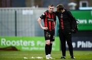 27 June 2025; Ross Tierney of Bohemians is consoled by physiotherapist Danny Miller after the SSE Airtricity Men's Premier Division match between Bohemians and Sligo Rovers at Dalymount Park in Dublin. Photo by Seb Daly/Sportsfile