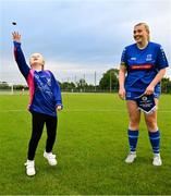 27 June 2025; Team mascot, Brooke Barry, age 7, flicks the coin before the match watched by Ella Gleeson of Newbridge Town before the Sports Direct Women's FAI Cup first round match between Newbridge Town and Whitehall at Greenogue Park in Dublin. Photo by Stephen Marken/Sportsfile