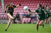 28 June 2025; Jennifer Buckley of Glanmire kicks a point despite the efforts Seraya Murphy of Charlestown during the LGFA Division 1 match between Glanmire and Charlestown at the John West Féile Peile na nÓg Gaelic Football and LGFA National Finals at Derry GAA Centre of Excellence in Owenbeg, Derry. Photo by Shauna Clinton/Sportsfile