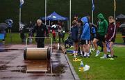 28 June 2025; U13 Javelin boys competitors await as the runway is dried by a member of groundstaff before day one of the 123.ie National Juveniles Track & Field Championships at Tullamore Harriers Athletics Club in Offaly. Photo by Ben McShane/Sportsfile