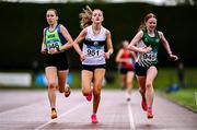 28 June 2025; Competitors, from left, Cara Mohan of Metro/St. Brigids AC, Dublin, Julie Cleary of Donore Harriers AC, Dublin, and Aisling Smith of Ballymena and Antrim AC, Antrim, on their way to finishing the Girls U19 3000m during day one of the 123.ie National Juveniles Track & Field Championships at Tullamore Harriers Athletics Club in Offaly. Photo by Ben McShane/Sportsfile