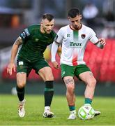 27 June 2025; Evan McLaughlin of Cork City in action against Jamie Lennon of St Patrick's Athletic during the SSE Airtricity Men's Premier Division match between Cork City and St Patrick's Athletic at Turner's Cross in Cork. Photo by Brendan Moran/Sportsfile