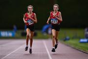 28 June 2025; Twin sisters Lucy Shore of Portlaoise AC, Laois, left, and Ava Shore of Portlaoise AC, Laois compete in the Girls Under 17 3000m during day one of the 123.ie National Juveniles Track & Field Championships at Tullamore Harriers Athletics Club in Offaly. Photo by Ben McShane/Sportsfile