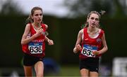 28 June 2025; Twin sisters Lucy Shore of Portlaoise AC, Laois, left, and Ava Shore of Portlaoise AC, Laois compete in the Girls Under 17 3000m during day one of the 123.ie National Juveniles Track & Field Championships at Tullamore Harriers Athletics Club in Offaly. Photo by Ben McShane/Sportsfile