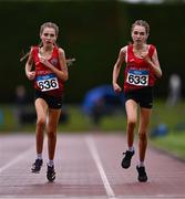 28 June 2025; Twin sisters Lucy Shore of Portlaoise AC, Laois, left, and Ava Shore of Portlaoise AC, Laois compete in the Girls Under 17 3000m during day one of the 123.ie National Juveniles Track & Field Championships at Tullamore Harriers Athletics Club in Offaly. Photo by Ben McShane/Sportsfile