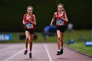 28 June 2025; Twin sisters Lucy Shore of Portlaoise AC, Laois, left, and Ava Shore of Portlaoise AC, Laois compete in the Girls Under 17 3000m during day one of the 123.ie National Juveniles Track & Field Championships at Tullamore Harriers Athletics Club in Offaly. Photo by Ben McShane/Sportsfile