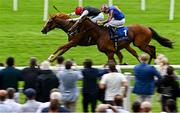 28 June 2025; Suzie Songs, left, with Colin Keane up, on their way to winning the Jebel Ali Racecourse Anglesey Stakes, from second place Flushing Meadows, right, with Ryan Moore up, during day two of the Dubai Duty Free Irish Derby Festival at The Curragh Racecourse in Kildare. Photo by Seb Daly/Sportsfile