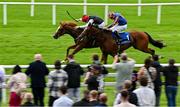 28 June 2025; Suzie Songs, left, with Colin Keane up, on their way to winning the Jebel Ali Racecourse Anglesey Stakes, from second place Flushing Meadows, right, with Ryan Moore up, during day two of the Dubai Duty Free Irish Derby Festival at The Curragh Racecourse in Kildare. Photo by Seb Daly/Sportsfile