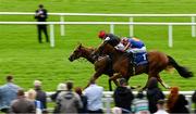 28 June 2025; Suzie Songs, left, with Colin Keane up, on their way to winning the Jebel Ali Racecourse Anglesey Stakes, from second place Flushing Meadows, right, with Ryan Moore up, during day two of the Dubai Duty Free Irish Derby Festival at The Curragh Racecourse in Kildare. Photo by Seb Daly/Sportsfile