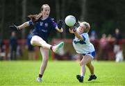 28 June 2025; Brinan O'Sullivan of New York has a score blocked by Emma McVey of Ballinderry Shamrocks during the LGFA Division 1 match between New York and Ballinderry Shamrocks at the John West Féile Peile na nÓg Gaelic Football and LGFA National Finals at Derry GAA Centre of Excellence in Owenbeg, Derry. Photo by Shauna Clinton/Sportsfile